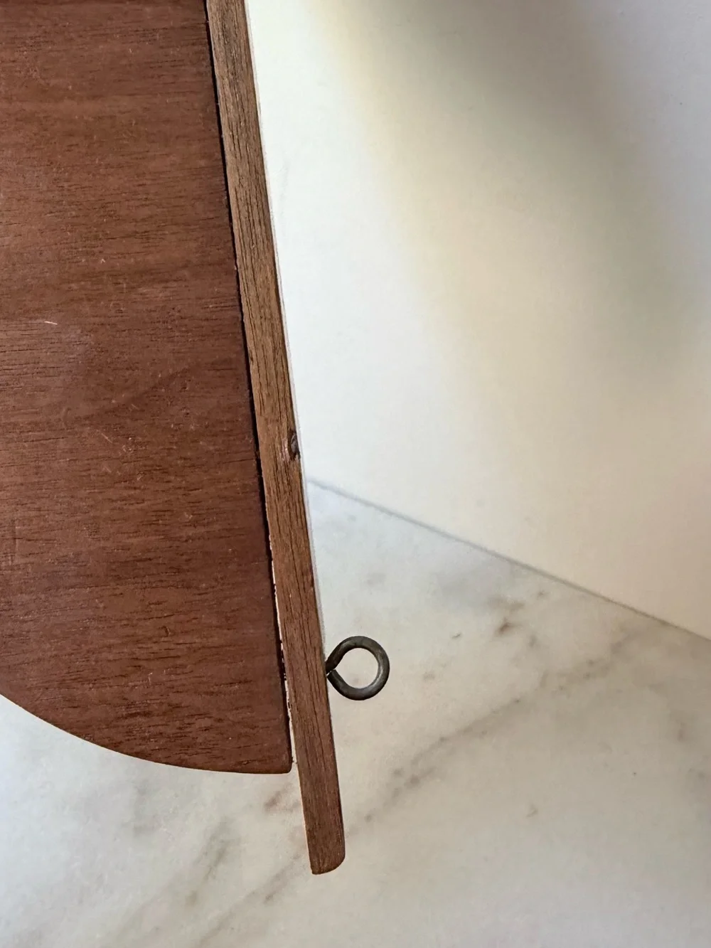 vintage wall sconce shelf made of carved wood with a dark finish